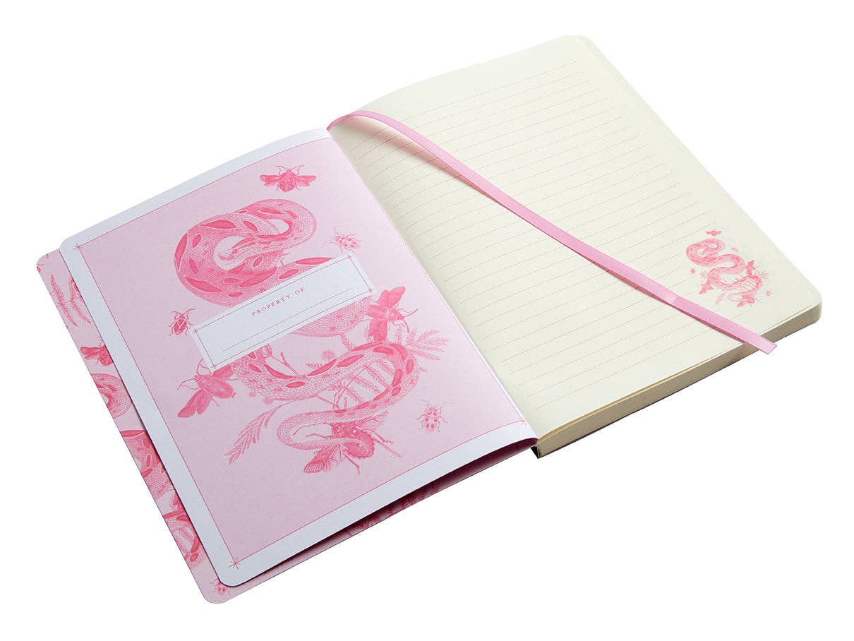 Open notebook with pink flamingo design on a white background