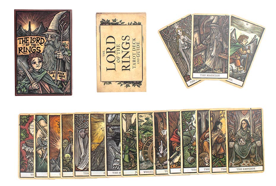 Collection of 'The Lord of the Rings' tarot cards with packaging and guidebook on a white background.