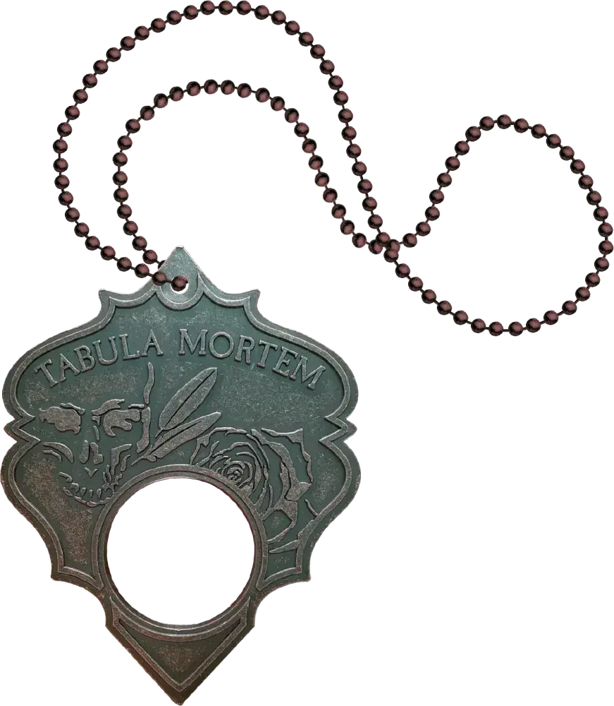 Decorative planchette pendant with 'Tabula Mortem' text and beaded chain on a white background
