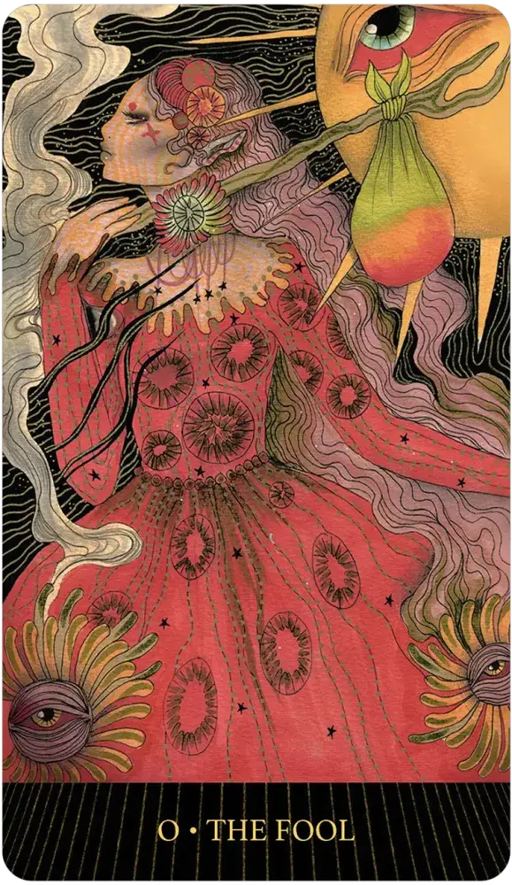 Tarot card featuring 'The Fool' with intricate designs and vibrant colors.