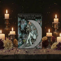 Cover of 'The Mind's Eye Tarot' by Olivia Rose featuring an illustration of a woman with flowers and celestial elements.