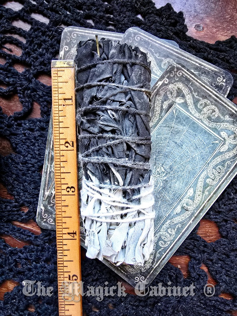 Wax bundles on a card with a ruler for scale, on a dark textured surface.