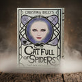 Book titled 'Cat Full of Spiders' by Christina Ricci with a cover featuring a woman's face and a cat.
