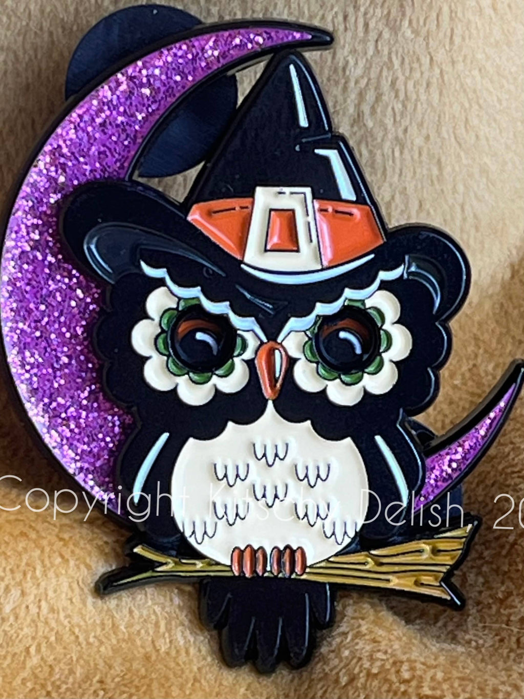 Halloween-themed owl with witch hat and purple crescent moon on a textured background
