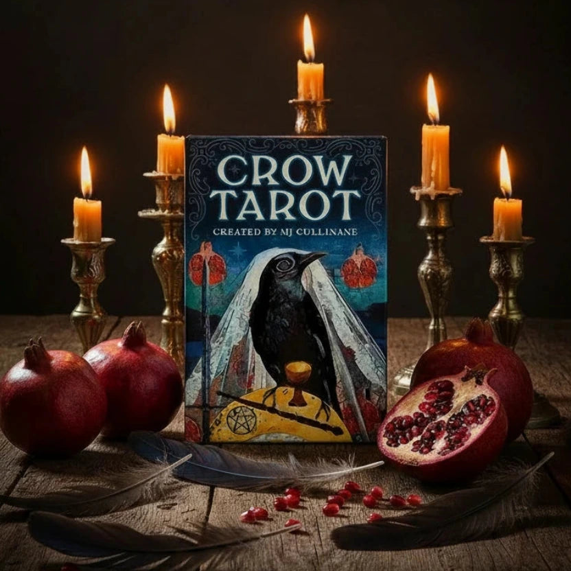 Imafe of the 'Crow Tarot' by MJ Cullinane featuring a crow, a chalice, and red cards.