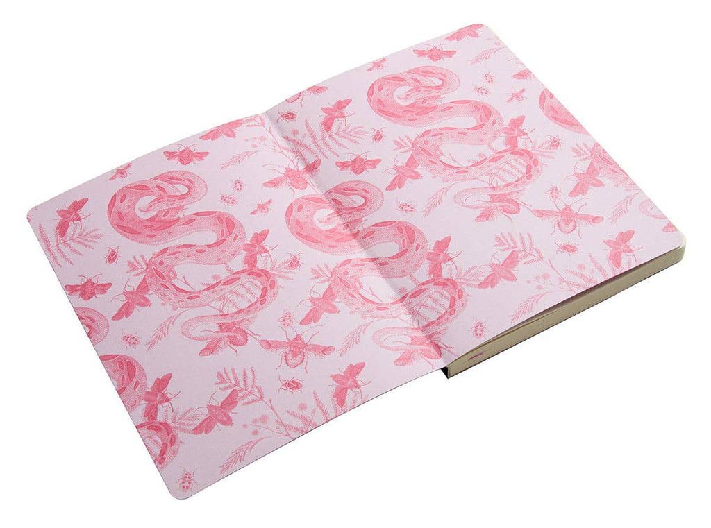 Open notebook with pink flamingo pattern on a white background